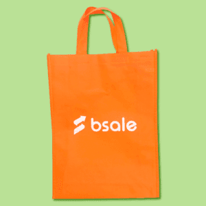 Bolsa TNT color naranjo con logotipo estampado Bsale en blanco