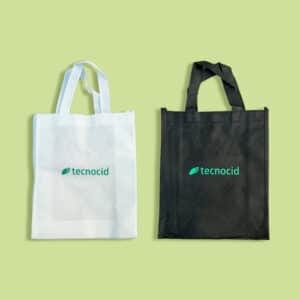 Bolsas TNT blanca y negra con logotipo de Tecnocid estampado en verde
